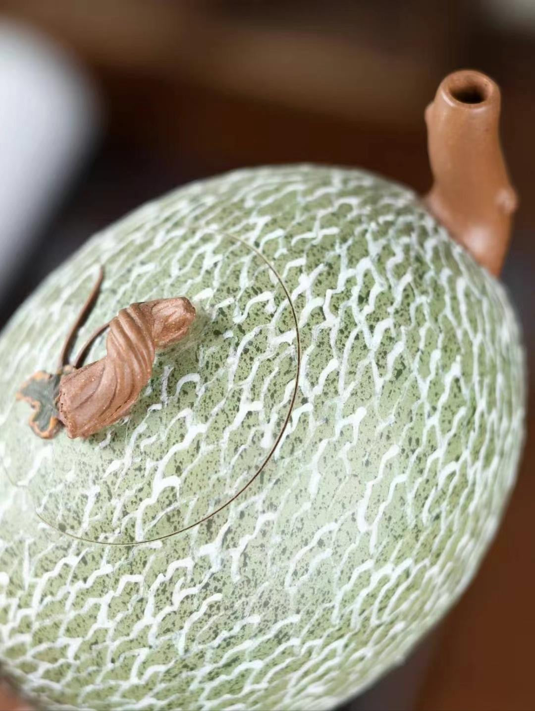 Handcrafted hami melon teapot made from fine purple clay