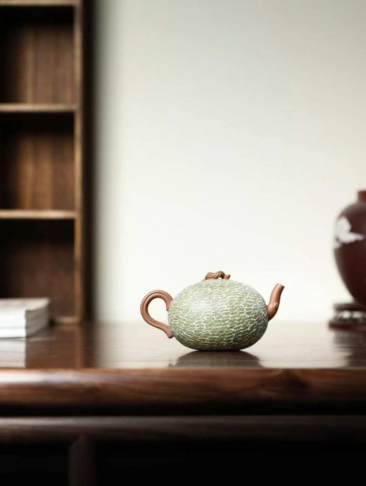 Handcrafted hami melon teapot made from fine purple clay