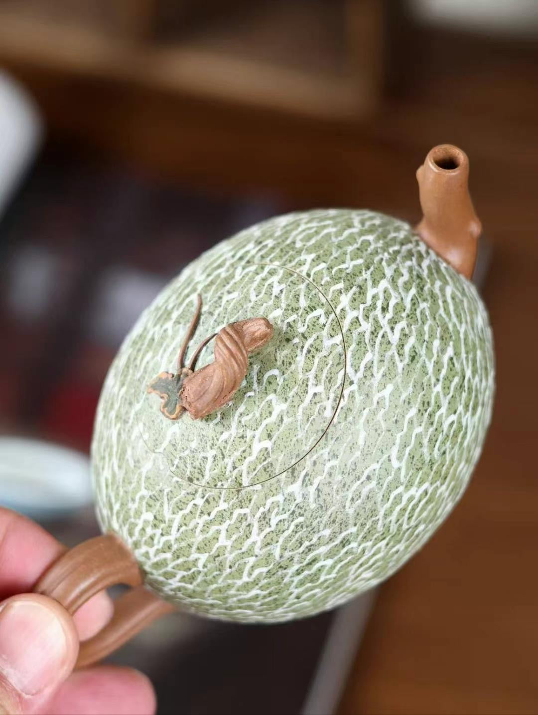 Handcrafted hami melon teapot made from fine purple clay