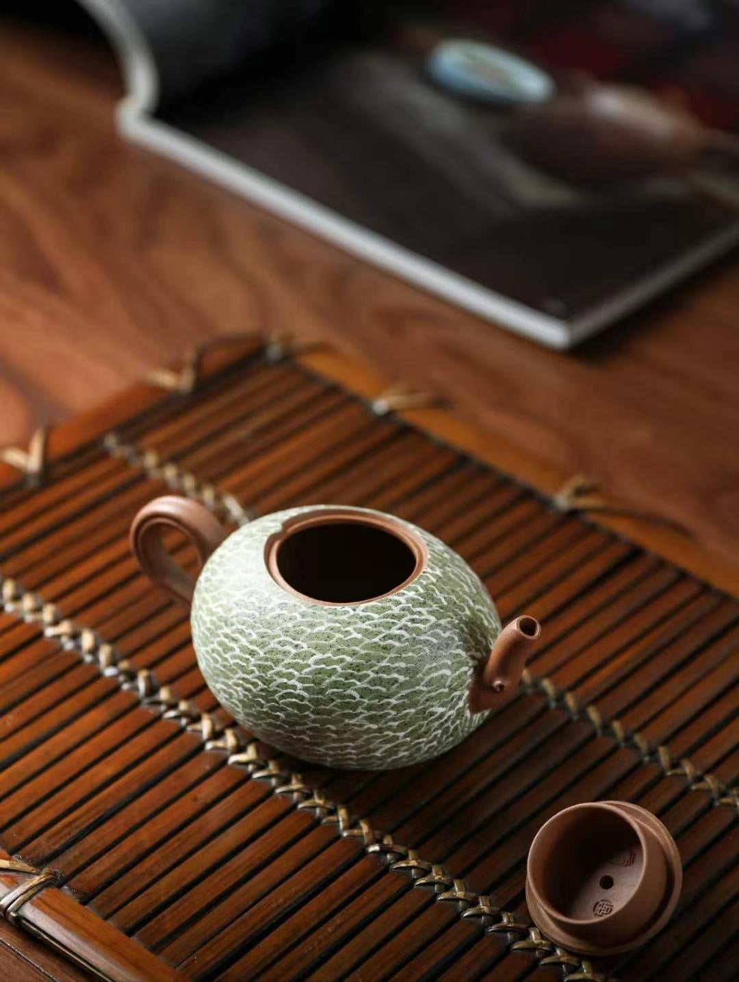 Handcrafted hami melon teapot made from fine purple clay