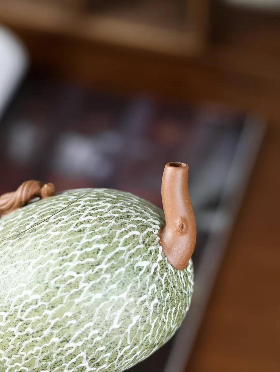 Handcrafted hami melon teapot made from fine purple clay